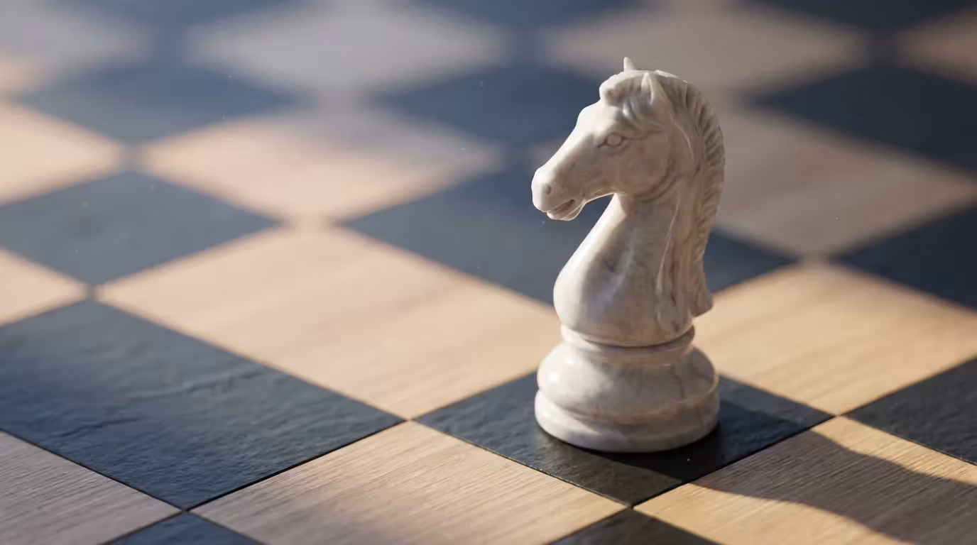 A close-up macro photograph of a white marble chess knight symbolizing financial strategy.
